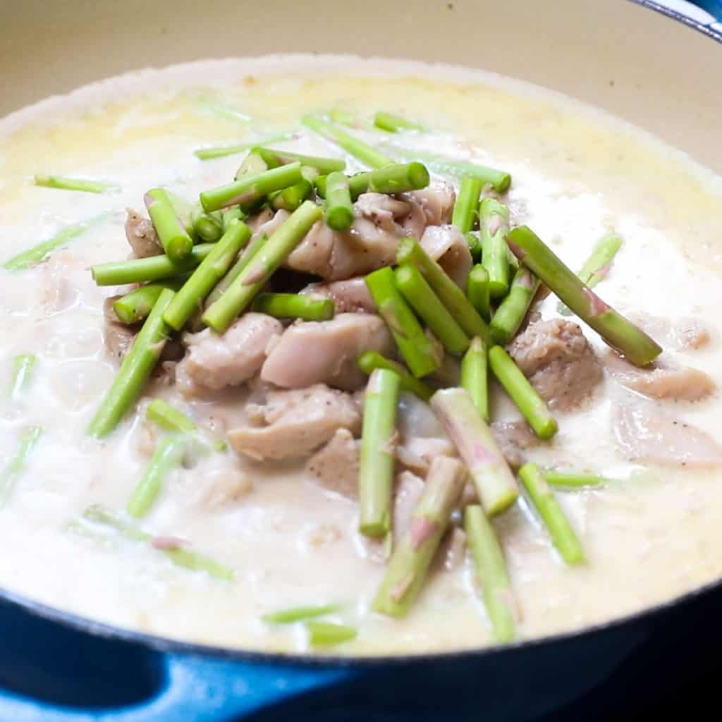 the chicken and asparagus stems added to the pan with the sauce