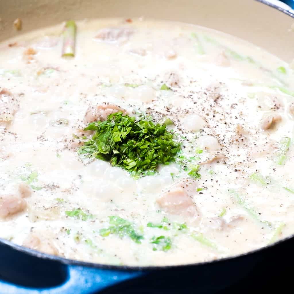 the chopped parsley added to the pan with the chicken mixture