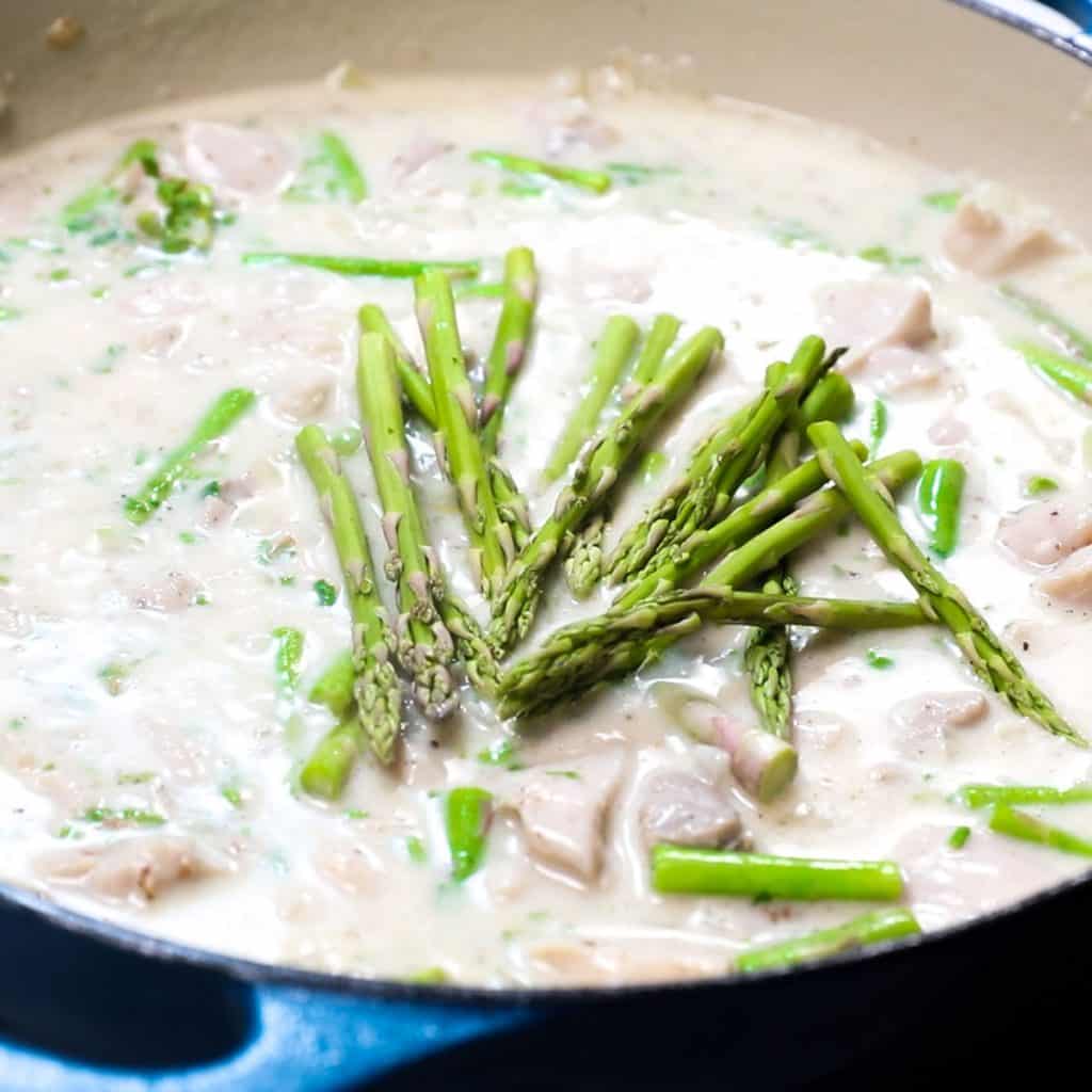 the asparagus tips added to the pan with the chicken mixture