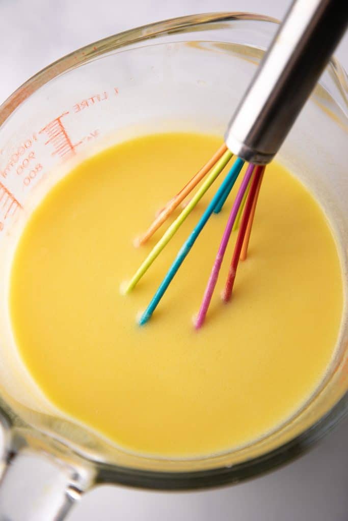 melted butter and eggs being whisked together