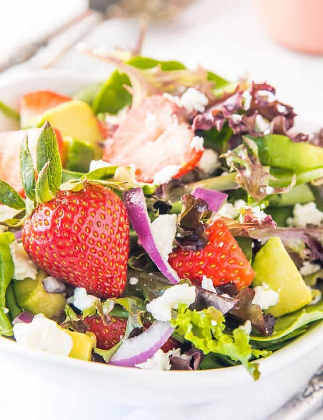 a bowl of fresh strawberry salad