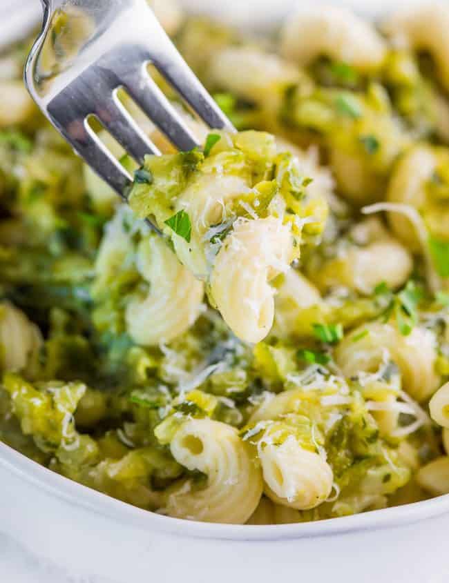 zucchini soup on pasta with a fork in it