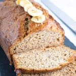 a banana bread loaf sliced and ready to eat