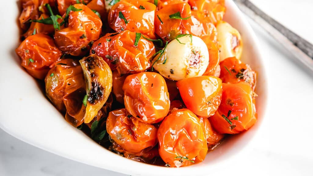 A bowl of roasted cherry tomatoes ready to serve