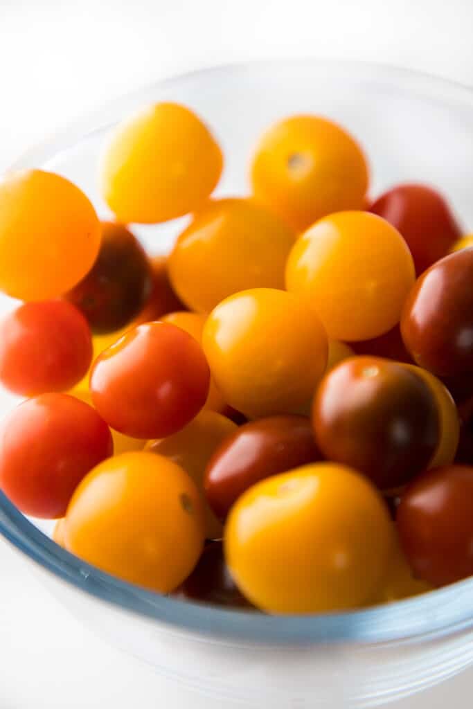 a bowl full of small tomatoes