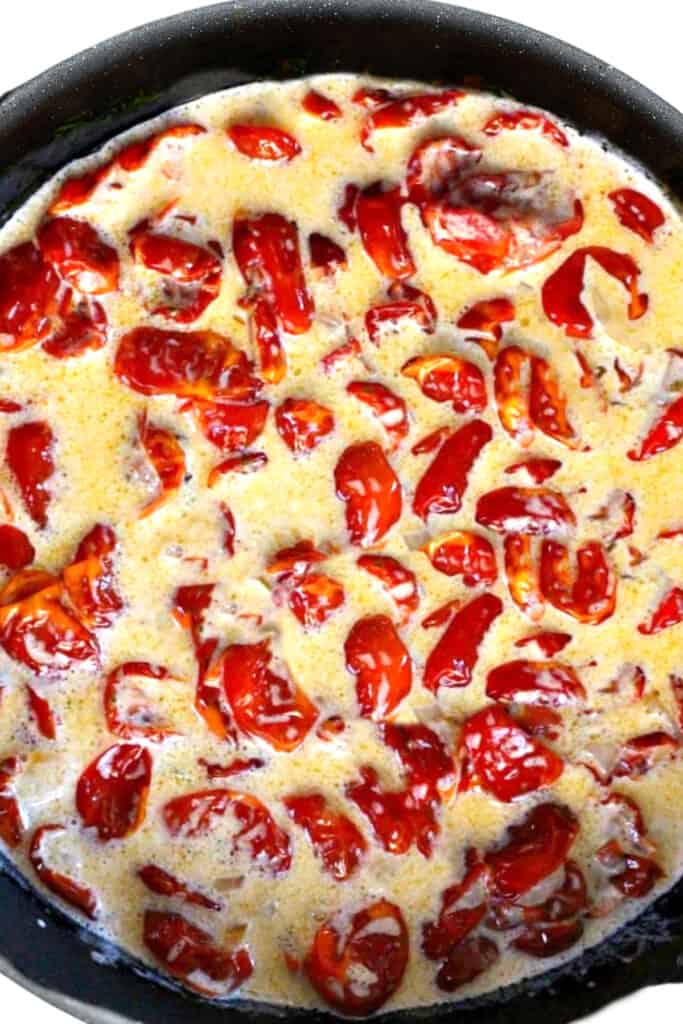 the tomato mixture with the cream added to the pan