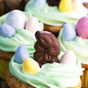 cupcakes with green swirld frosting and easter candy on top