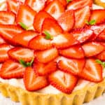 a custard tart topped with strawberries