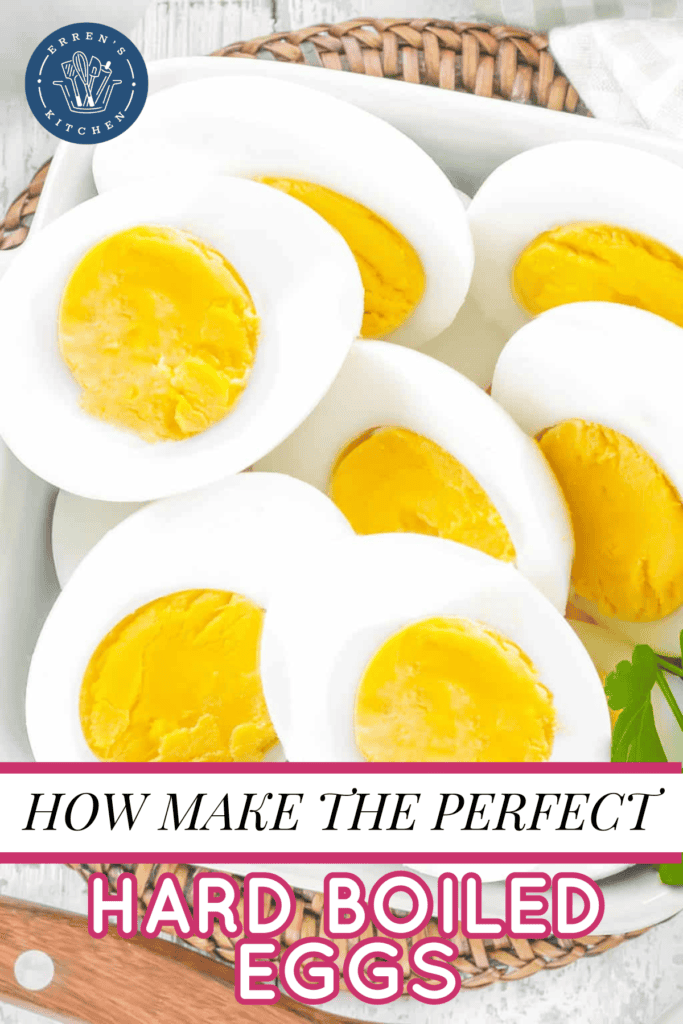 A pile of hard boiled eggs sliced in half so you can see the cooked yolk in the center.