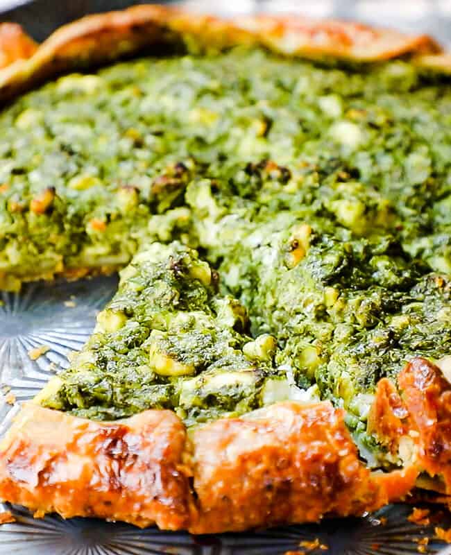 a slice of Savory Galette with Spinach and Feta on a pan