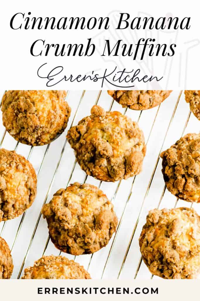 An image displaying freshly baked Cinnamon Banana Crumb Muffins on a wire cooling rack. The muffins are golden brown with a textured, crumbly topping. Above the muffins, there's large text that reads 'Cinnamon Banana Crumb Muffins' and below, the text 'Erren's Kitchen' followed by the website 'ERRENSKITCHEN.COM' in bold letters.