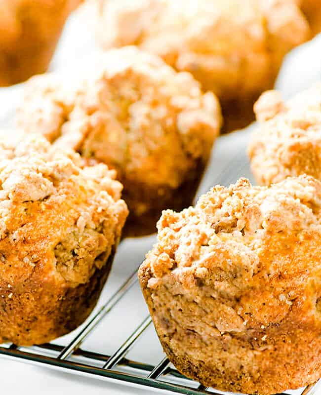 a cooling rack full of Cinnamon Banana Crumb Muffins