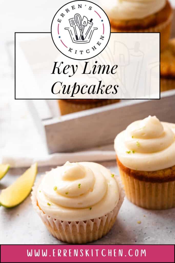 A promotional image showing Key lime cupcake with creamy frosting, topped with a lime slice and zest, in a white liner on a marble background.