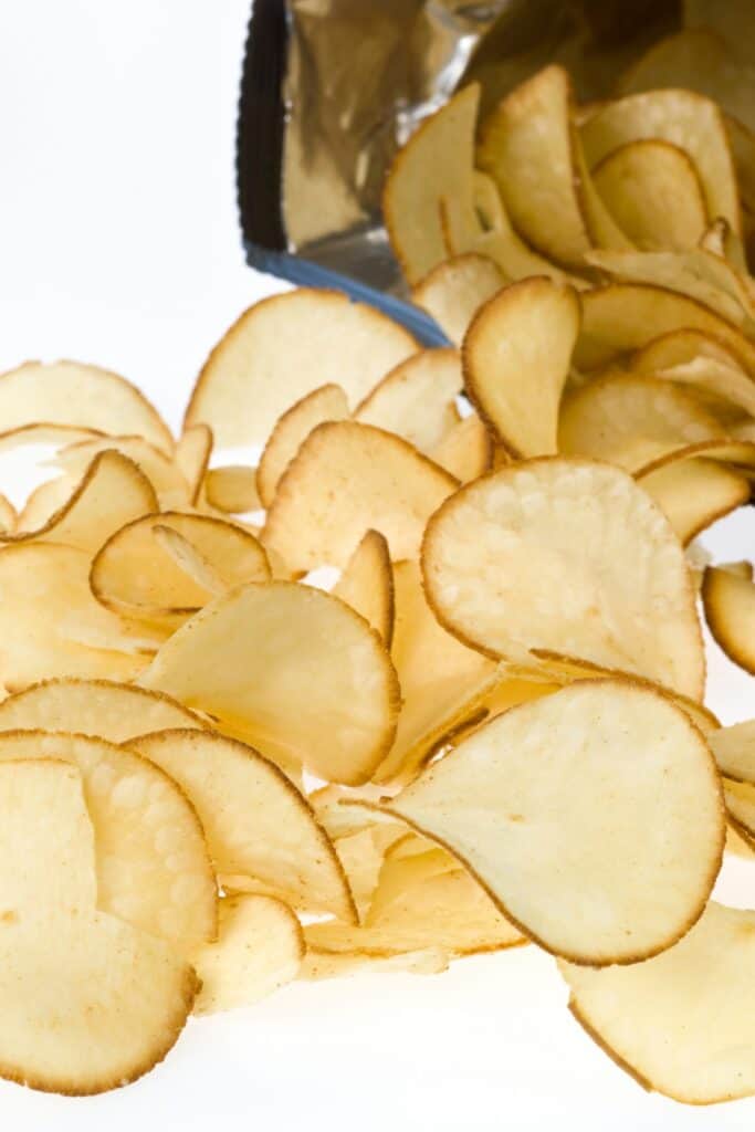 a bag of yuca chips spilling out onto a white table