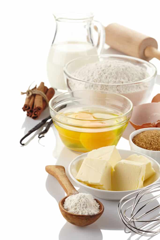 Ingredients for baking cake isolated on white background