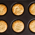 The freshly baked cupcakes in a pan.