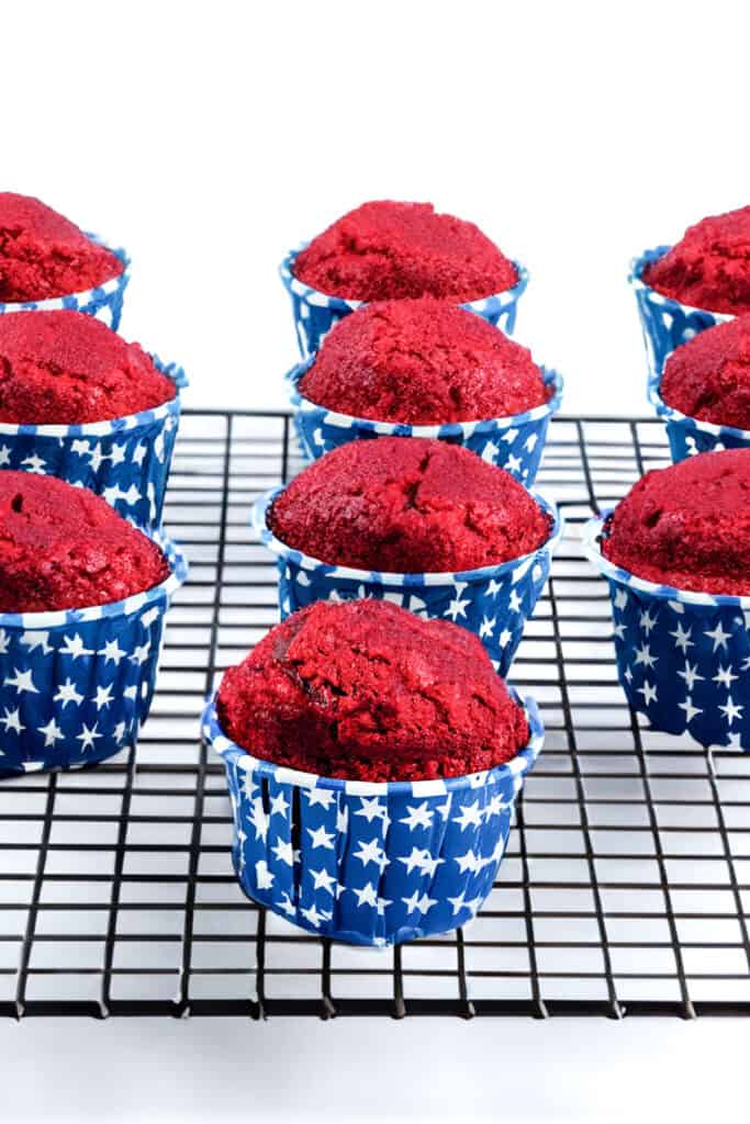 the cupcakes cooling on a cooling rack.