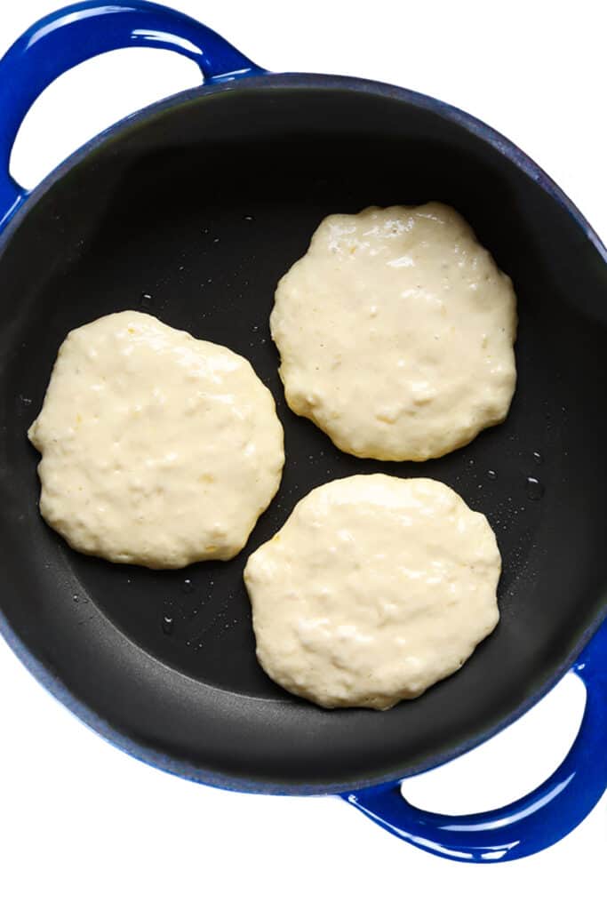 three pancakes formed in a pan