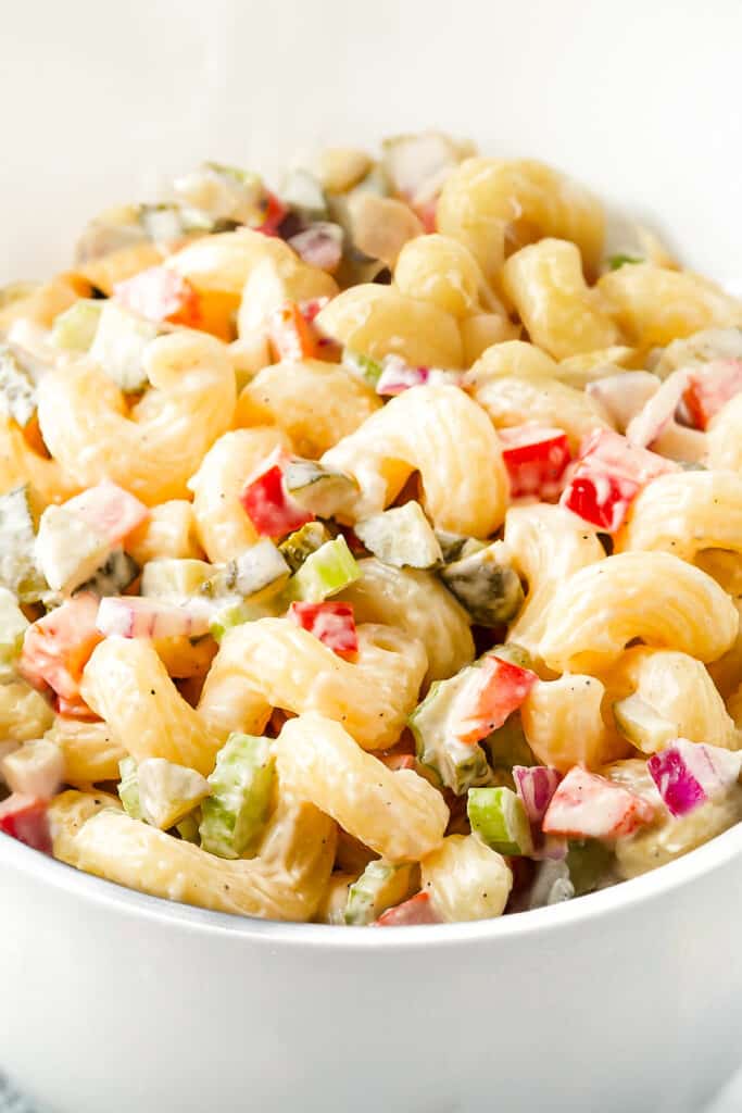 a close up image of a bowl of Amish Macaroni Salad