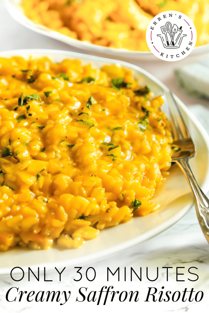 A delicious looking bowl filled with orange colored saffron risotto and sprinkled with parsley on top.