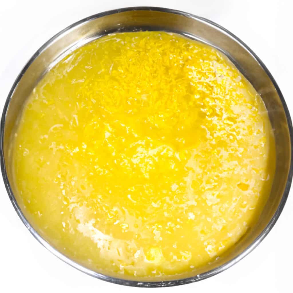 the lemon juice and egg mixture for the lemon curd in a metal mixing bowl.