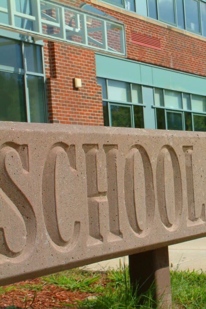 a school sign outside a building