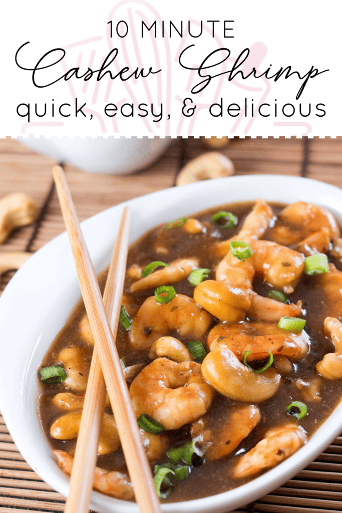 A bowl of cashew shrimp sprinkled with green onions and chopsticks laying across the bowl.