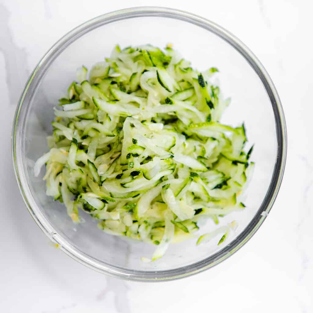 a bowl of grated Zucchini for making Zucchini bread