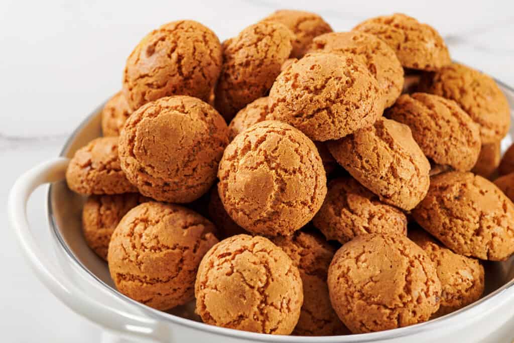 A big platter of Amaretti Cookies with a white background.