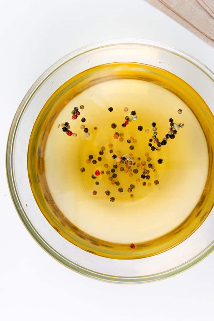 a close up image of the turkey brine in a glass bowl.