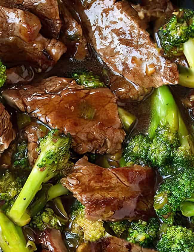 A pan of beef and broccoli stir fry with a brown sauce.