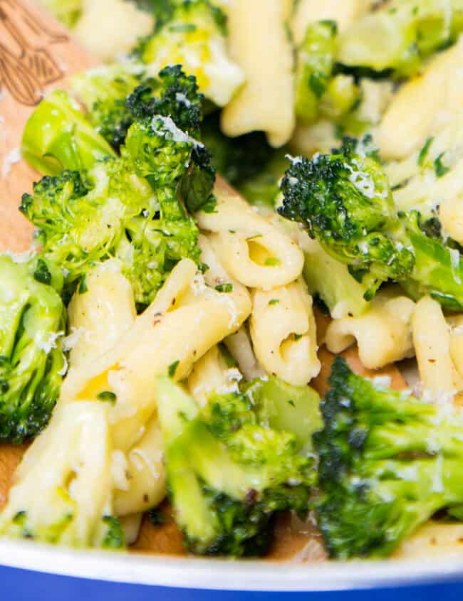 a close up image of a pan of Cavatelli and Broccoli with a serving spoon