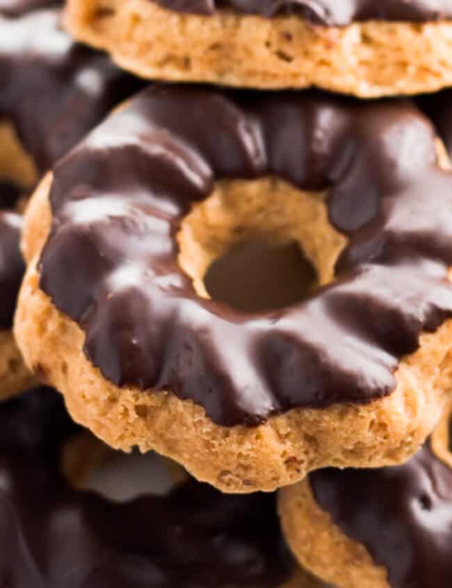 Shortbread cookies dipped in chocolate stacked on top of each other.