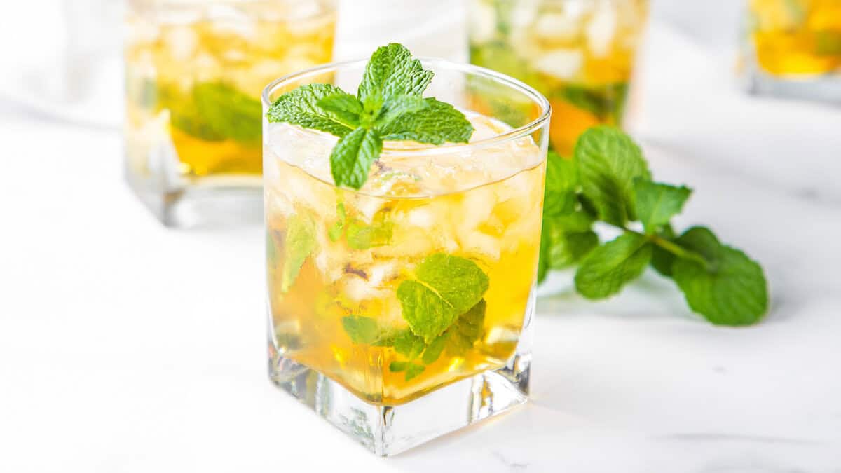 A sprig of mint in a Mint Julep Cocktail.