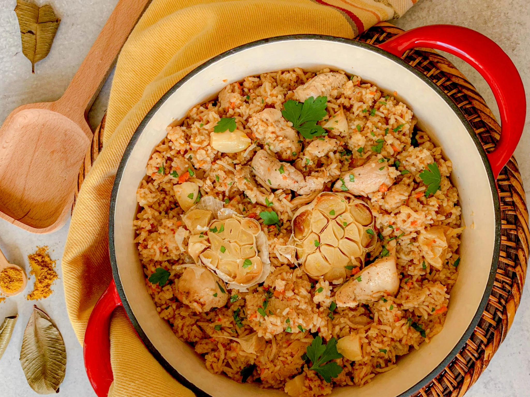 a red pot of chicken and rice Plov ready to serve.
