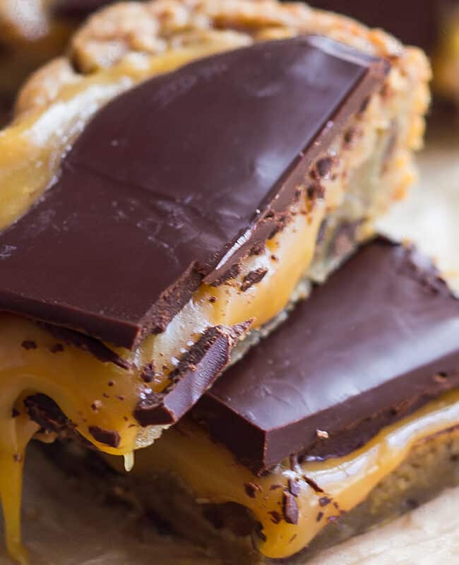 Salted caramel blondies with a chocolate chip cookie base and dark chocolate topping.