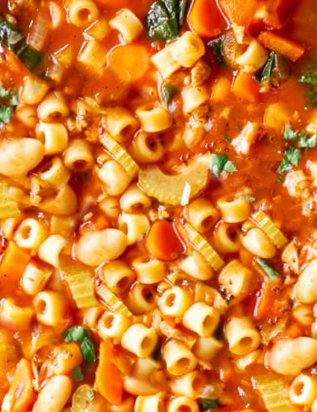 a close up image of Pasta Fagioli Soup in a large pot.