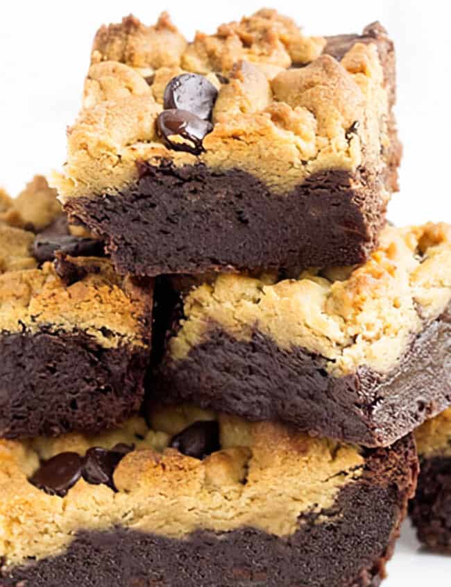 A pile of Rich, fudgy brownies topped with mounds of peanut butter cookie topping.