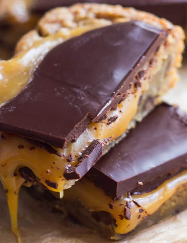 Salted caramel blondies with a chocolate chip cookie base and dark chocolate topping.