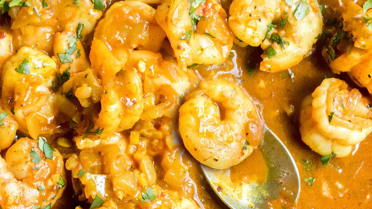 A close up image of Shrimp Coconut Curry cooked in the pan ready to serve.