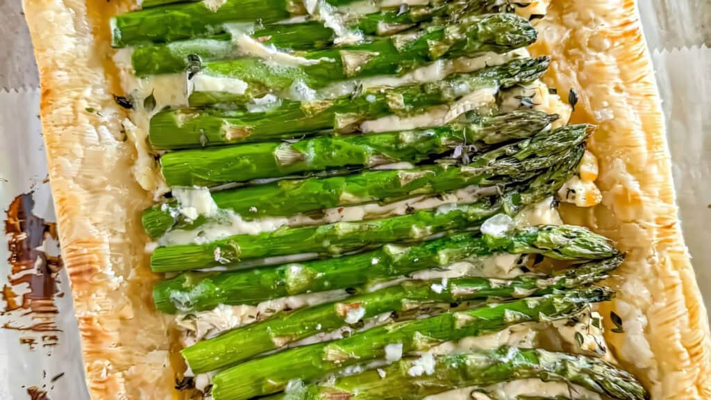 a close up image of creamy Asparagus on Puff Pastry.