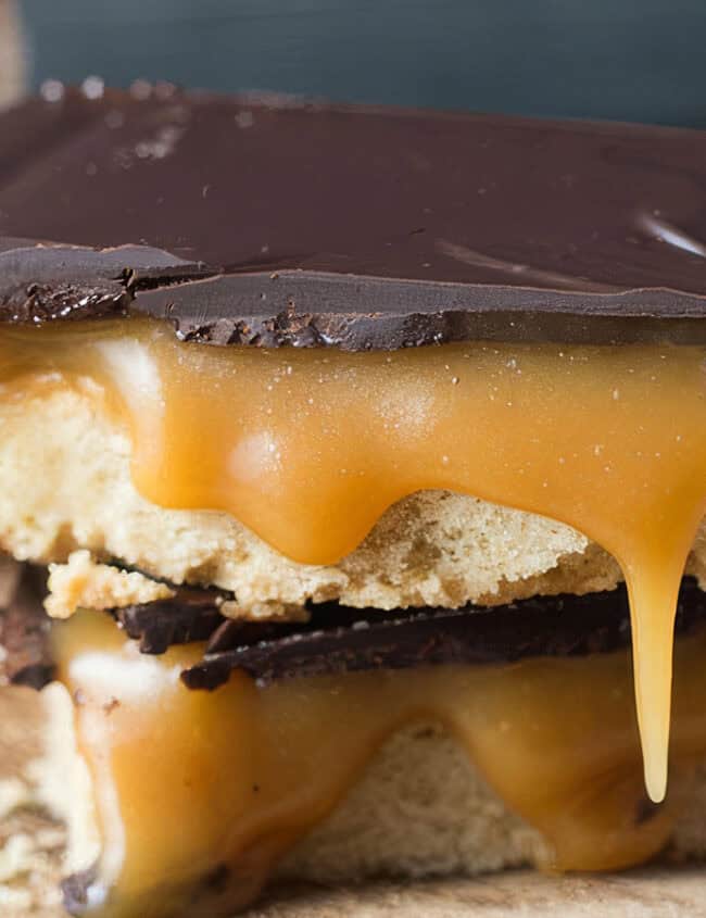 A close up image of 2 Billionaire Shortbread bars stacked on top of each other.