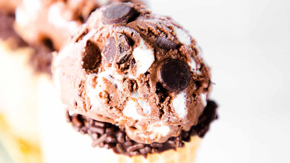 three ice cream cones filled with scoops of Chocolate Marshmallow Ice Cream.