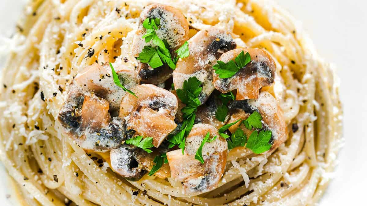 A photo with a close up image of Creamy Mushroom Spaghetti.