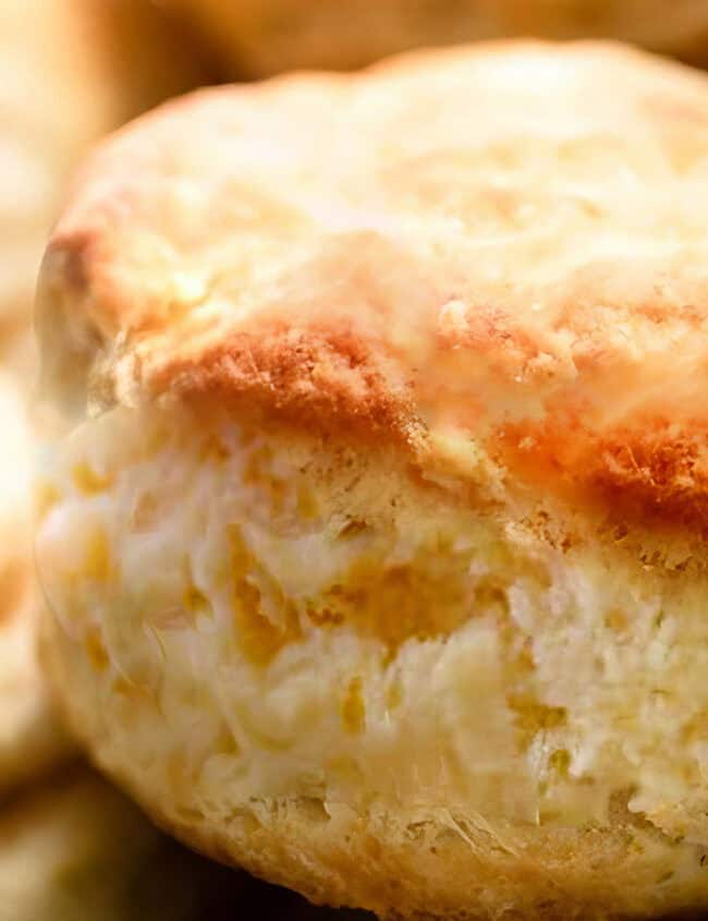 A close up of a freshly baked Buttermilk Biscuits in a basket.