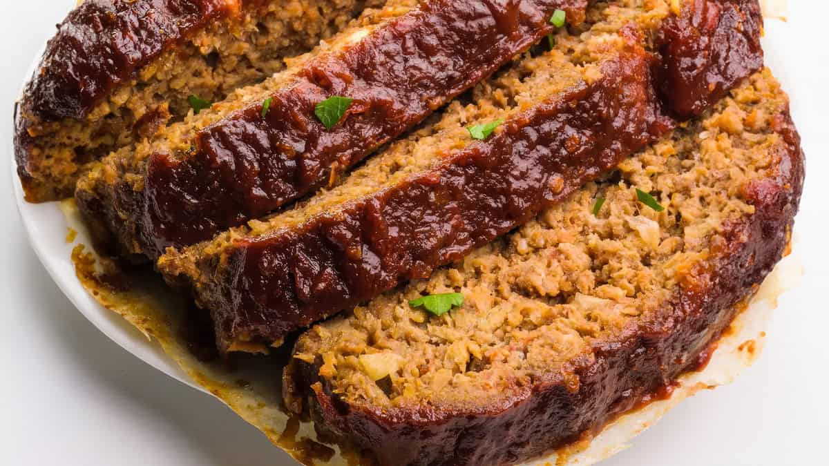 a close up image of a sliced Impossible Meatloaf.