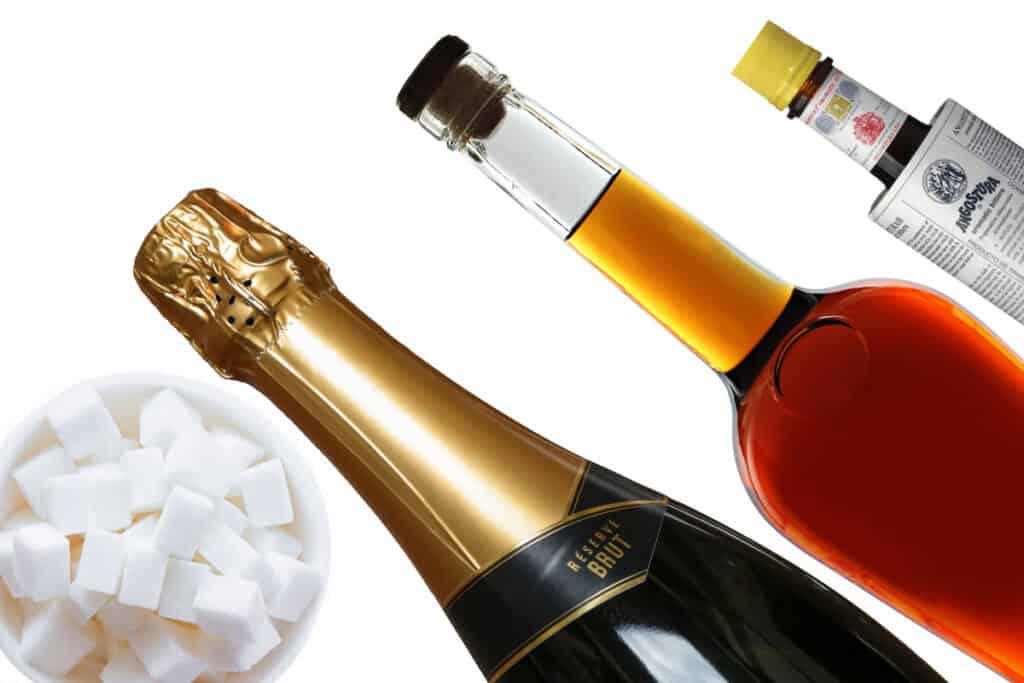 Champagne cocktail ingredients with a white background