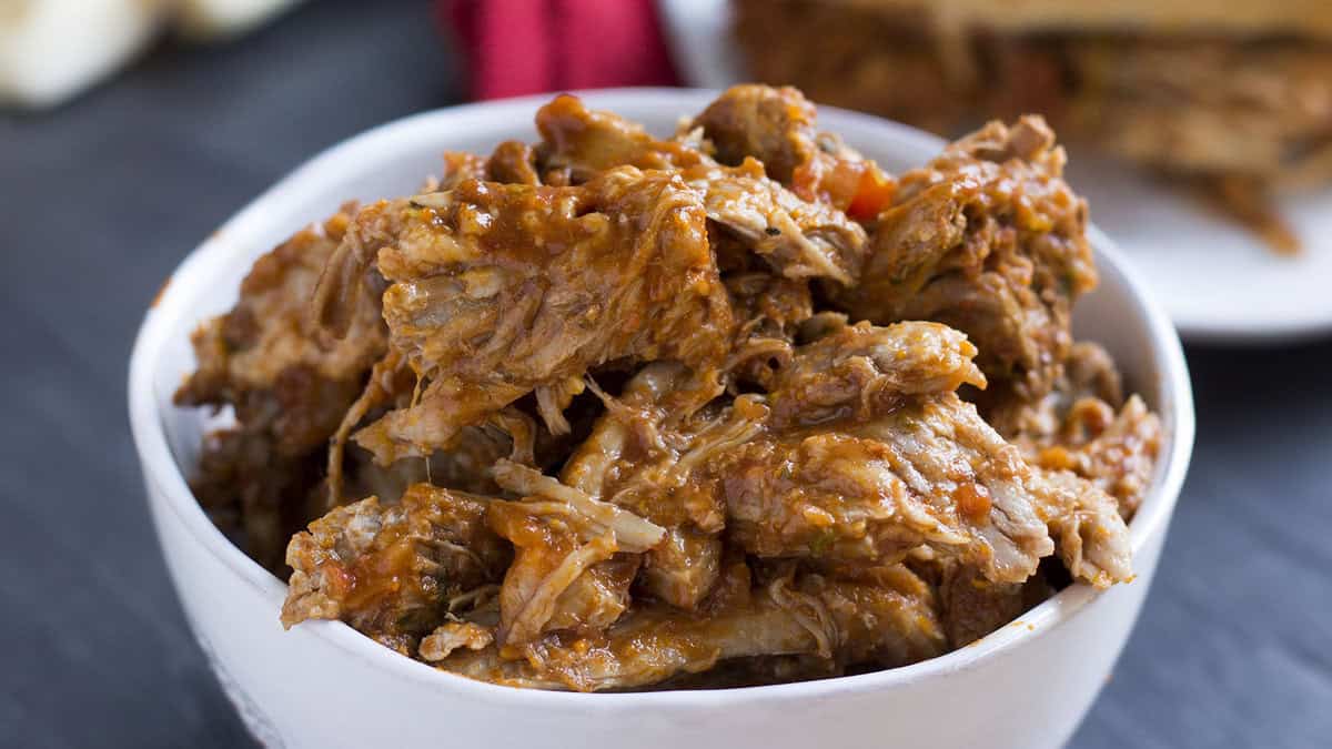 A white bowl full of Italian Pulled Pork.