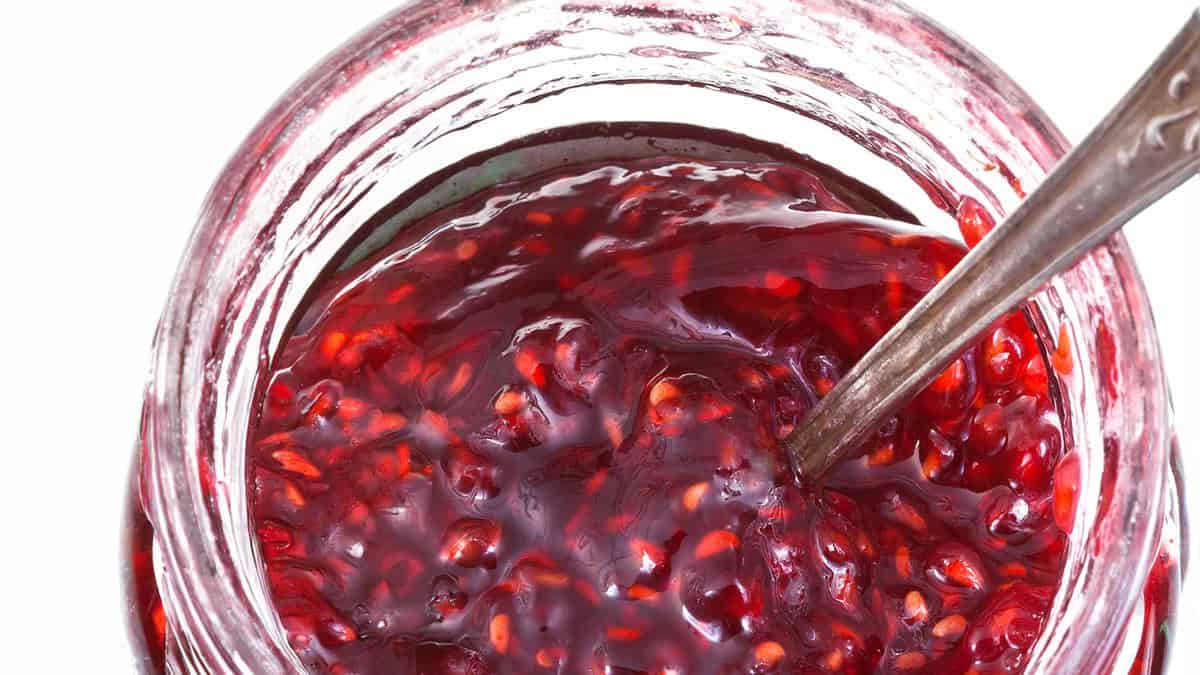 Top view of jar of raspberry jam.