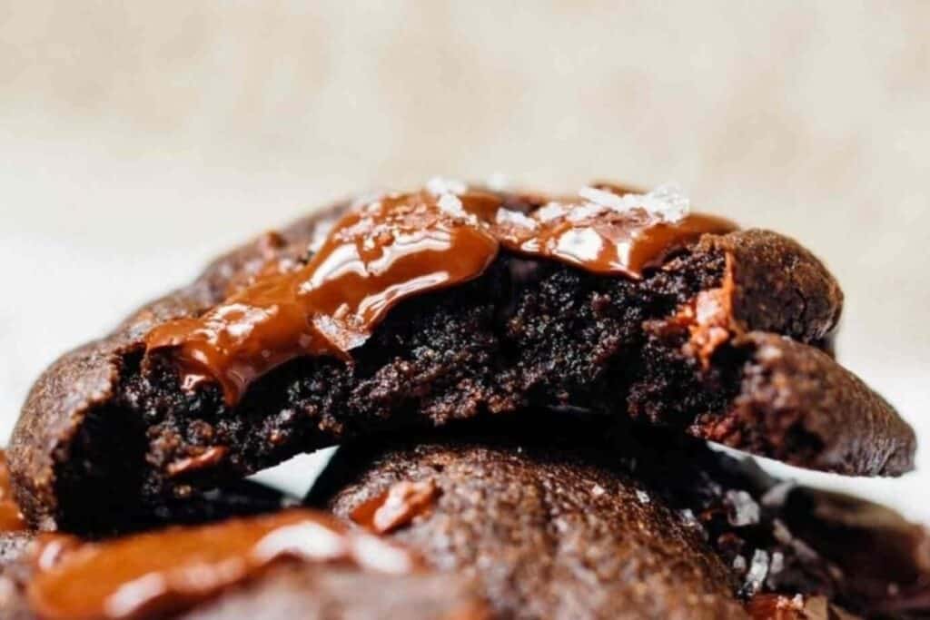 A close up image of gooey Dark Chocolate And Cherry Cookies.